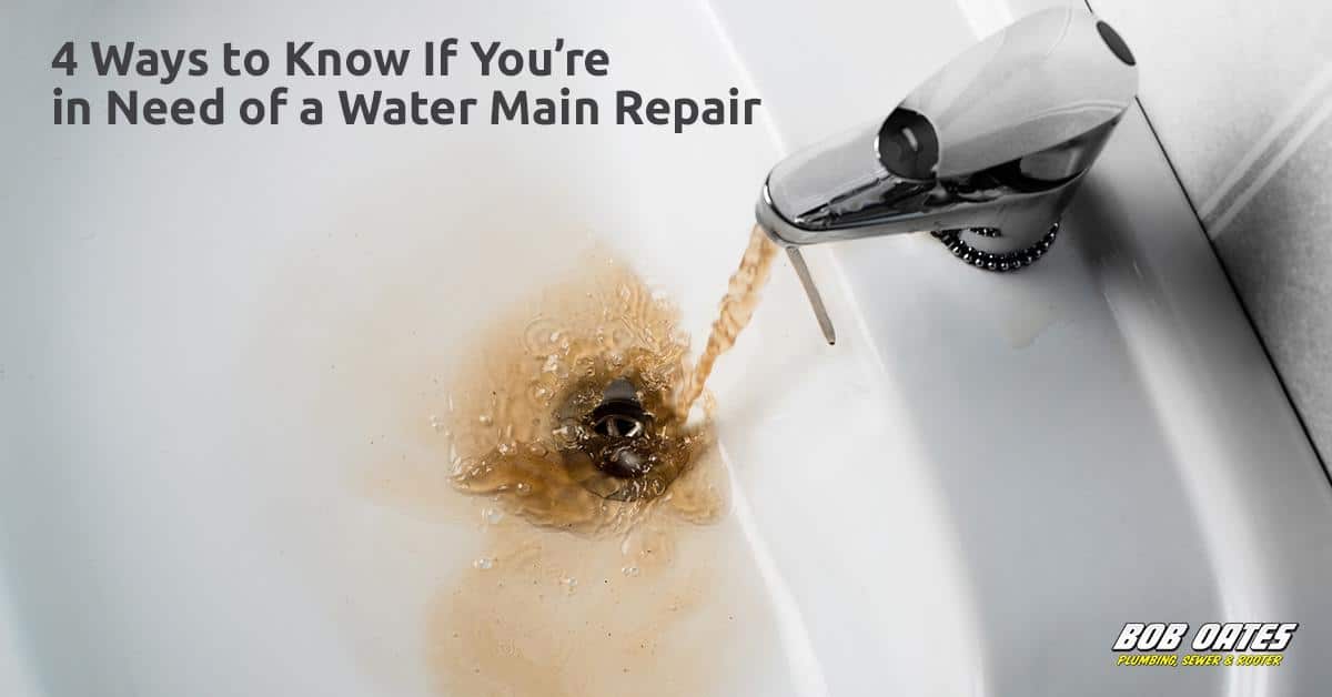 Discolored Tap Water from a Damaged Water Main Brown, rusty water pouring from a bathroom faucet into a white sink, indicating possible water main damage.
