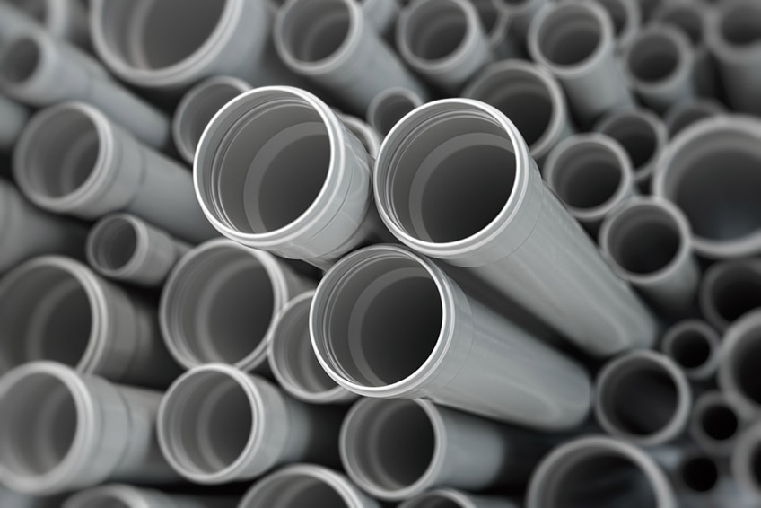 Stacked PVC plastic pipes and tubes
