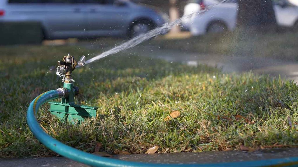 Sprinkler running in yard