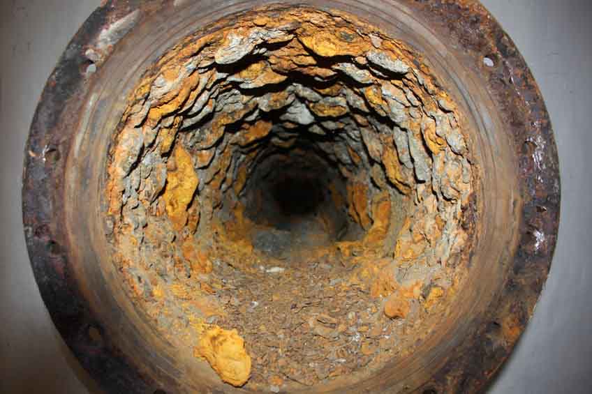 Pipe section showing metal erosion