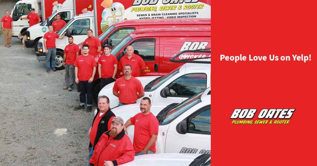 Bob Oates technicians beside work vehicles