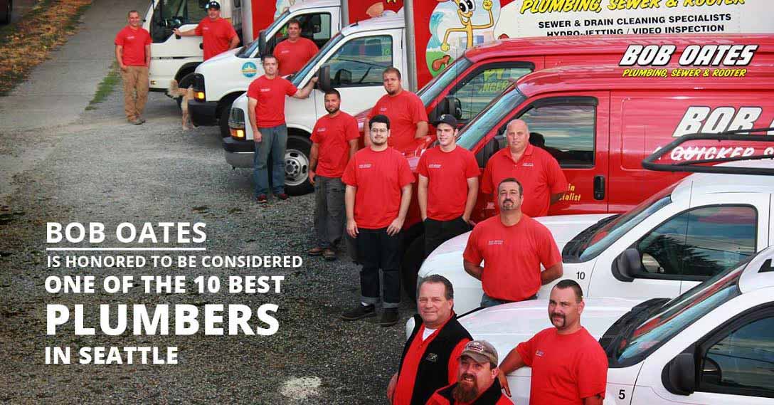 Bob Oates Sewer & Rooter technicians standing next to work trucks