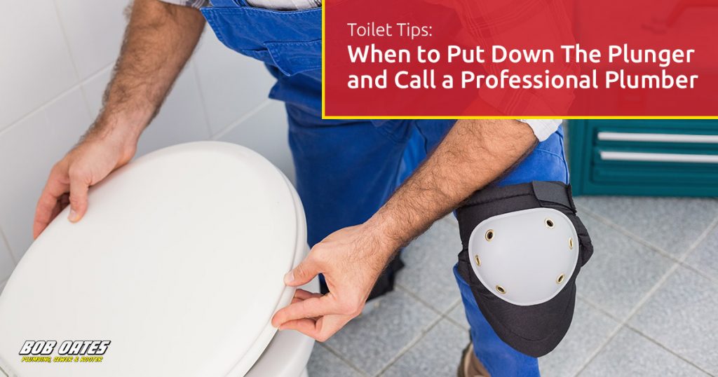 Plumbing technician fixing a toilet