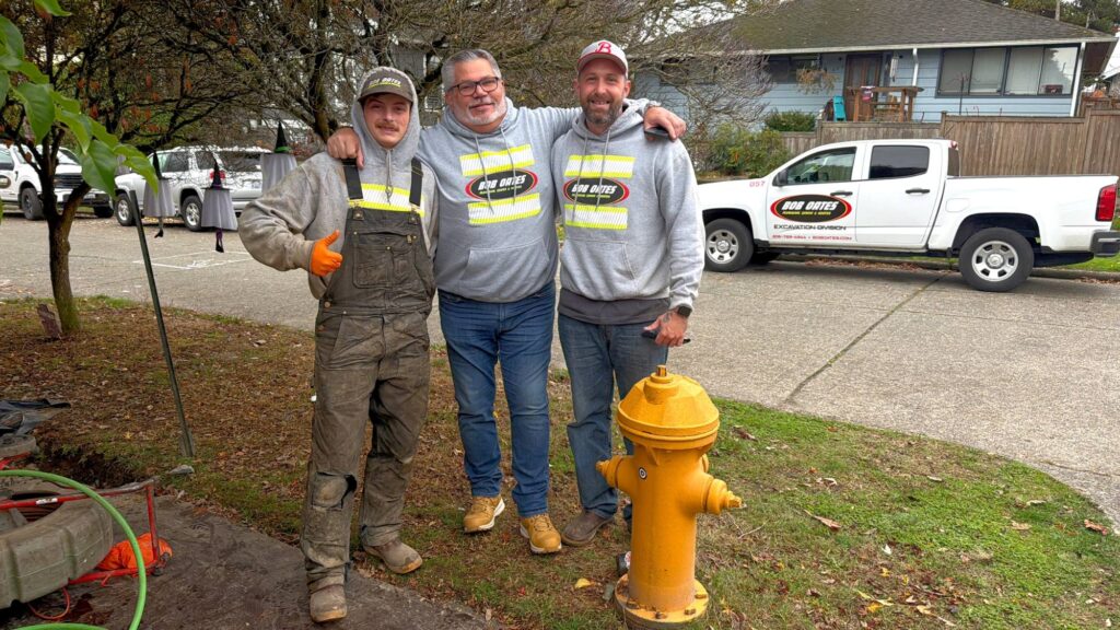 Bob Oates plumbing team after completing a successful sewer service job