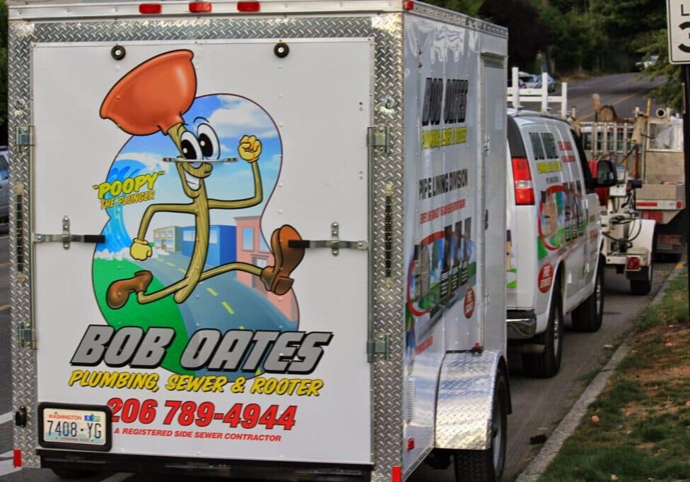Bob Oates Plumbing, Sewer & Rooter Pipe Lining Division trailer with Poopy the Plunger mascot in Seattle