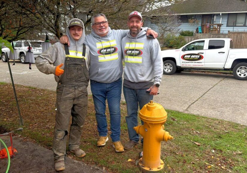 Bob Oates plumbing team after completing a successful sewer service job