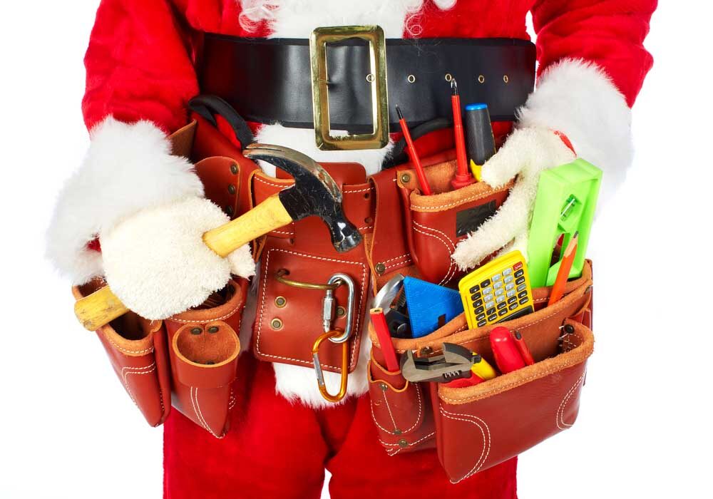 Santa wearing a tool belt filled with plumbing tools, representing common plumbing issues during the holiday season in Seattle homes